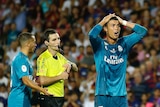 Real Madrid's Cristiano Ronaldo reacts after being sent off against Barcelona