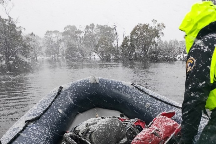 Police search and rescue team on a dinghy.