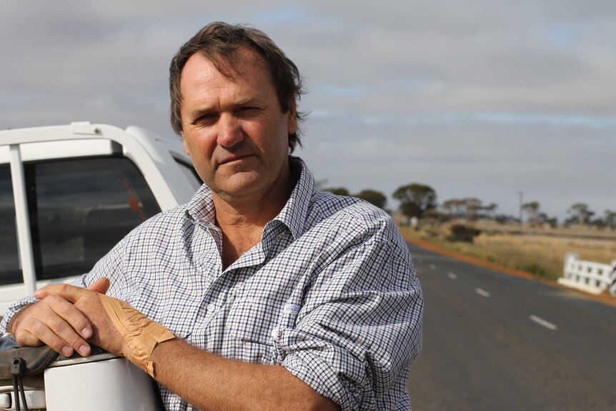 Farmer Brett Willcocks standing beside his car on a country road near Lake Grace in the Great Southern region of Western Austral