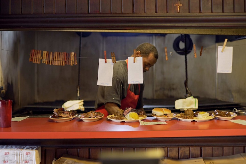 Food is laid out on a counter in a Texan restaurant.