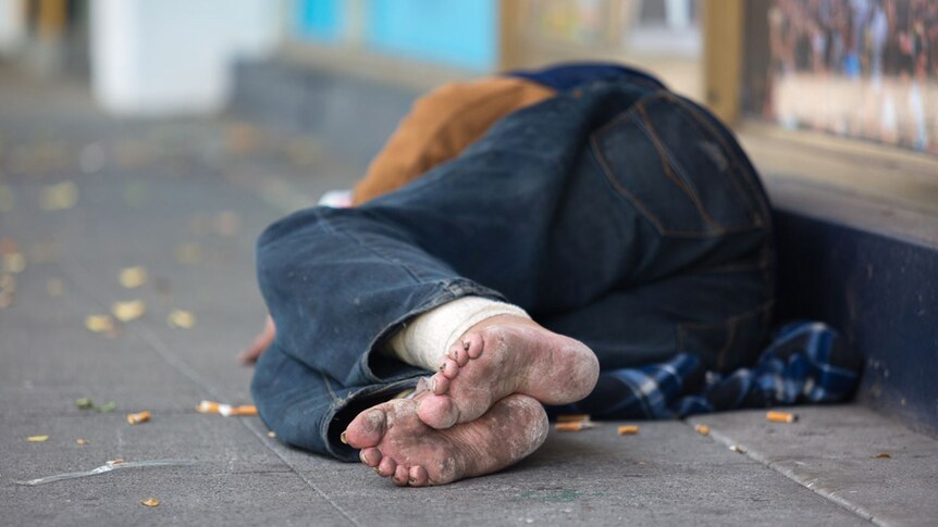 A homeless person sleeps on Fitzroy Street in St Kilda, November 19, 2018.