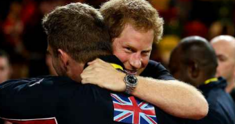Prince Harry hugging another man at Invictus Games