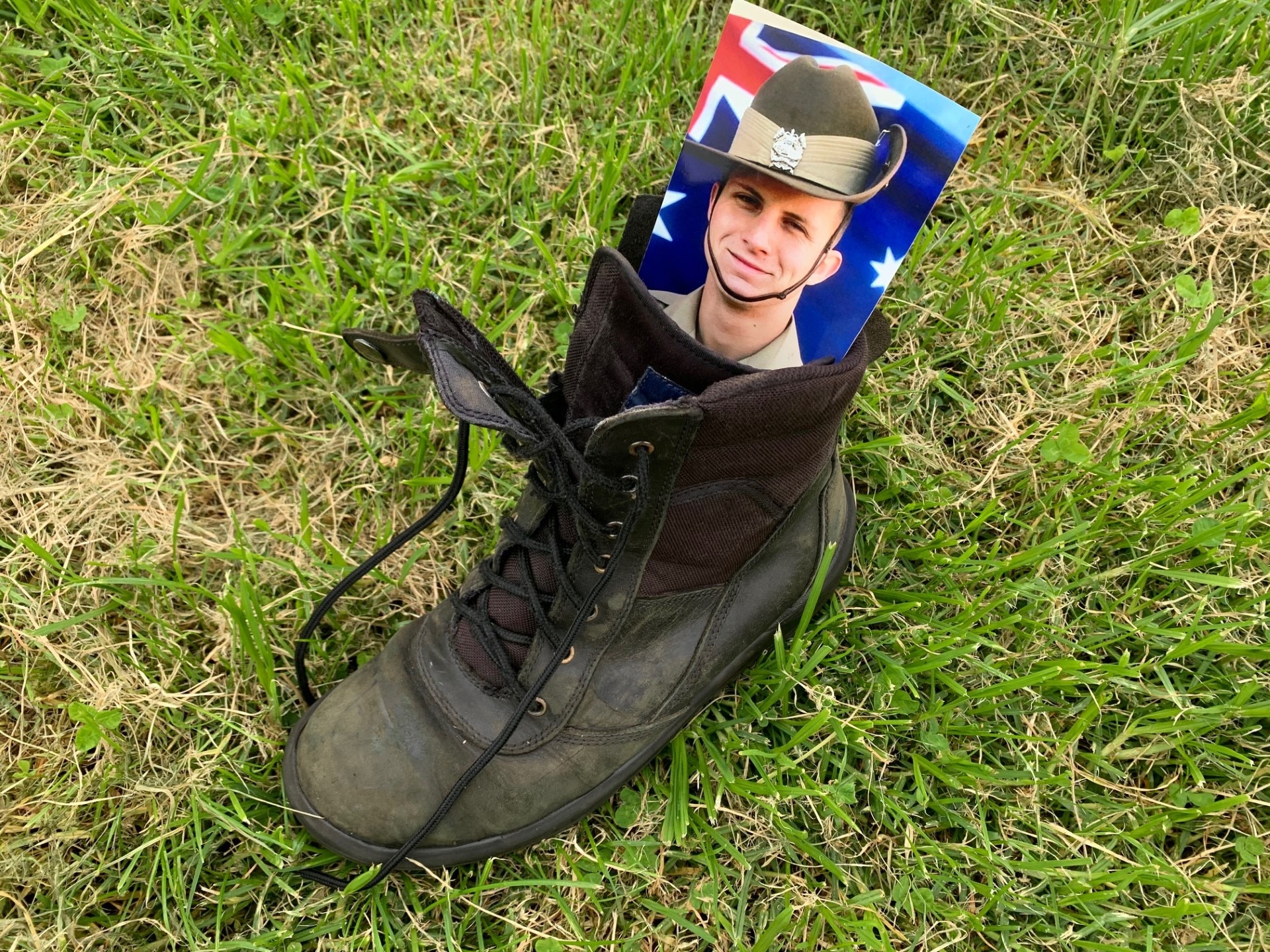 Boot with photograph of army soldier.
