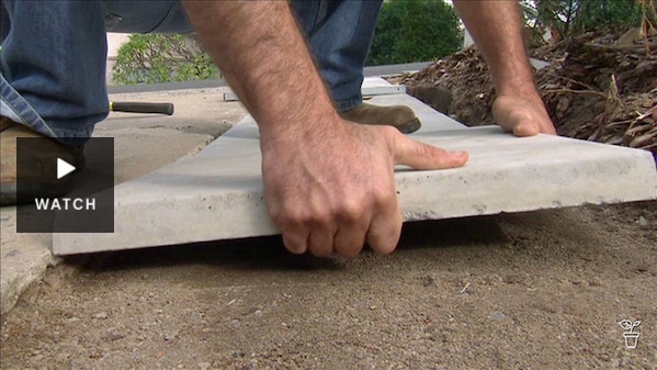 Large paver being placed on the ground. Has Video.