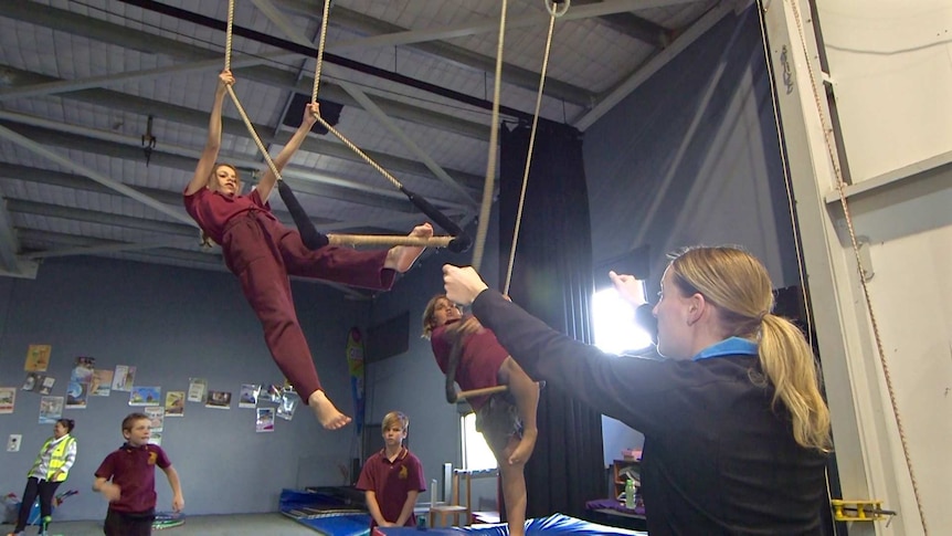 The classes are supervised by trained circus performers