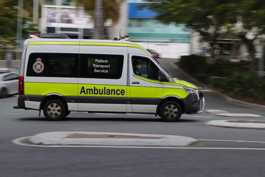 An ambulance driving outside Royal Brisbane and Women's Hospital