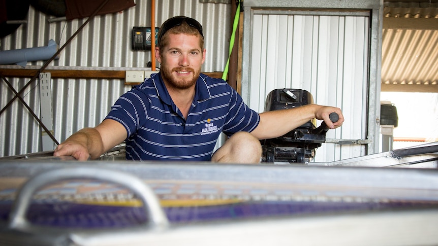 Reece Glazbrook sits in the tinny he will race in the 2016 Riverland Dinghy Derby at Renmark