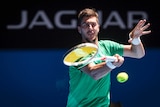 Thanasi Kokkinakis of Australia in action against Canada's Vasek Pospisil at the 2017 Hopman Cup.