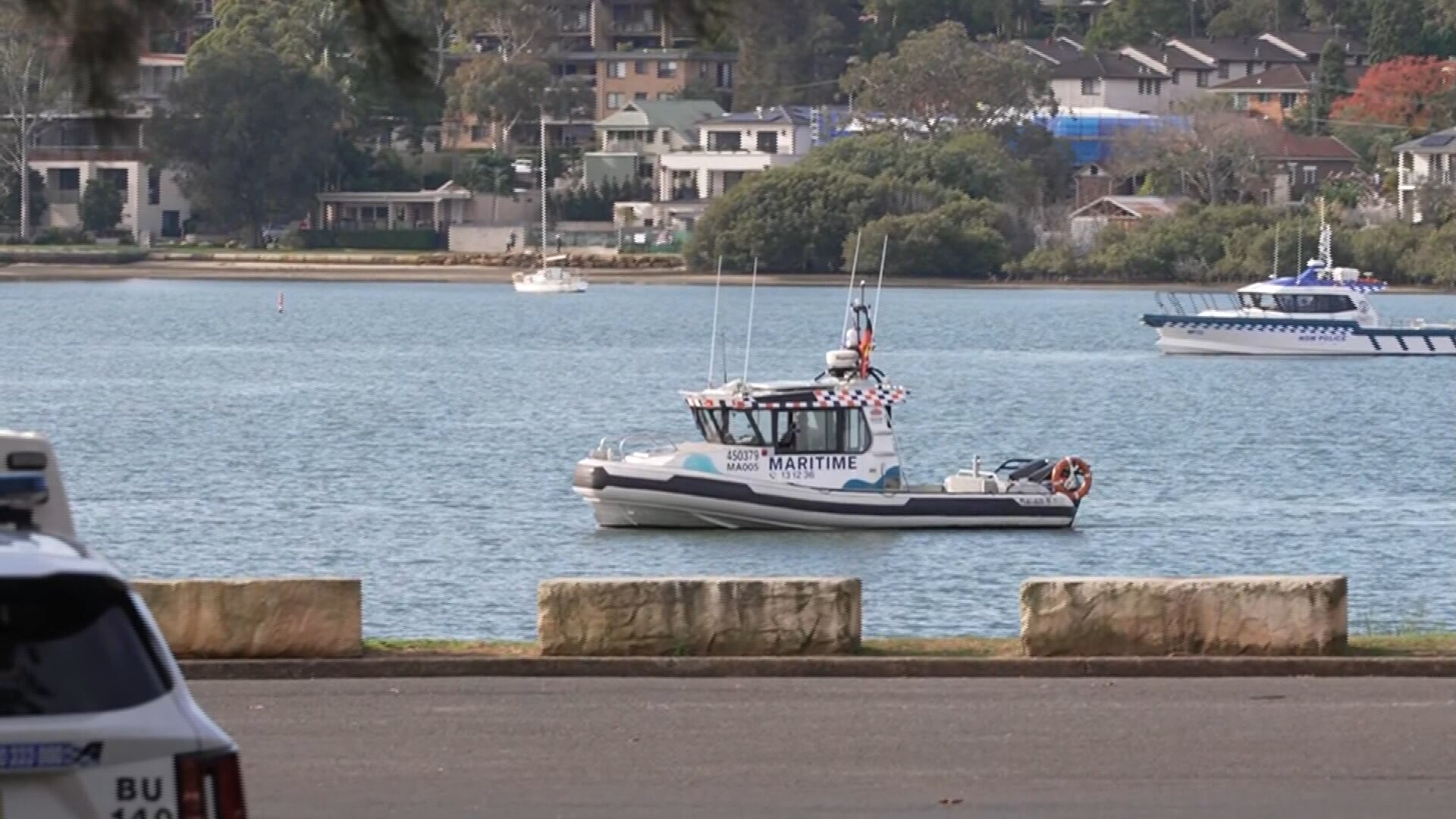 Two maritime NSW boats in a harbour area.