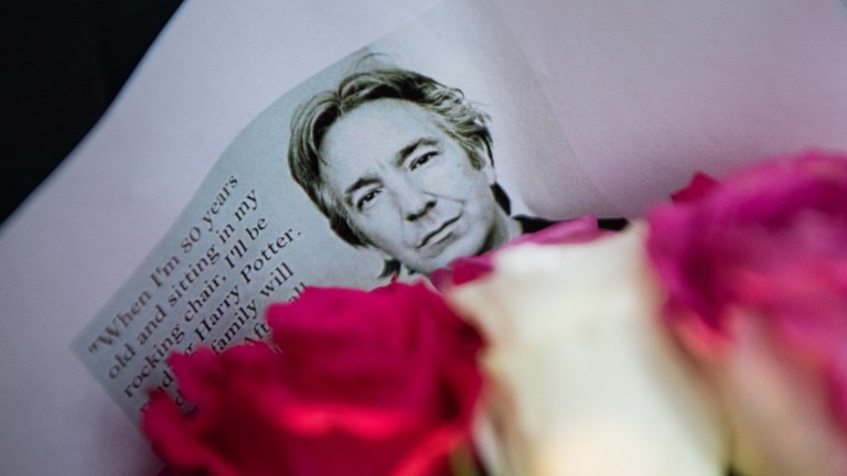Floral tributes to British actor Alan Rickman at London's Kings Cross station