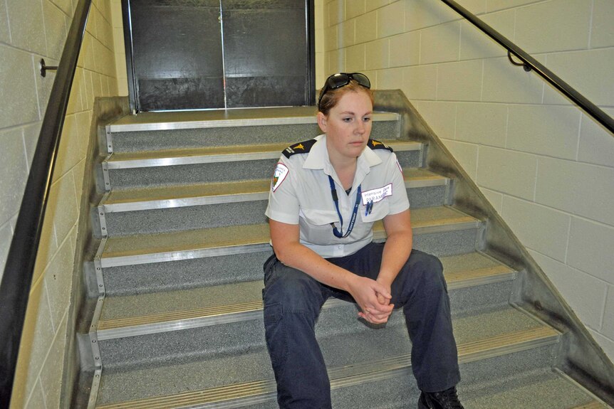 Lauren Hepher sits on some steps.