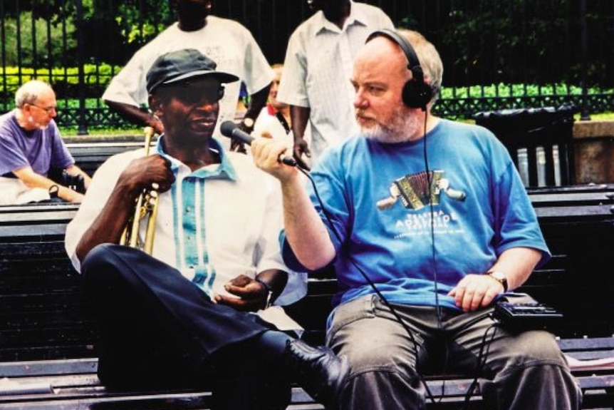 Andrew Ford interviewing a trumpeter on the streets of New Orleans.