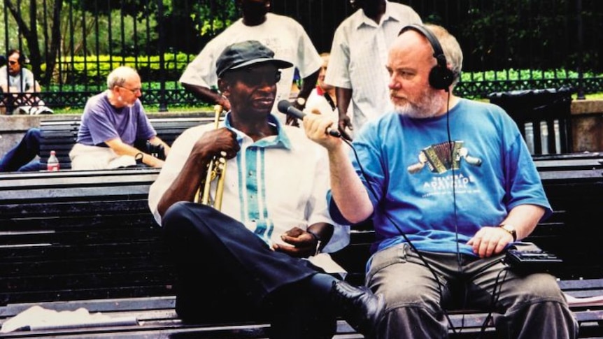 Andrew Ford interviewing a trumpeter on the streets of New Orleans.