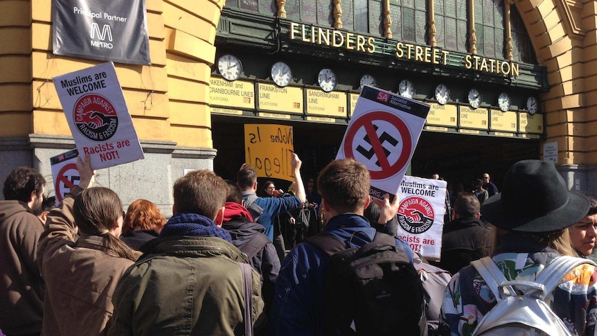 Crowds protest against Australian Border Force visa checks in the Melbourne CBD August 28, 2015