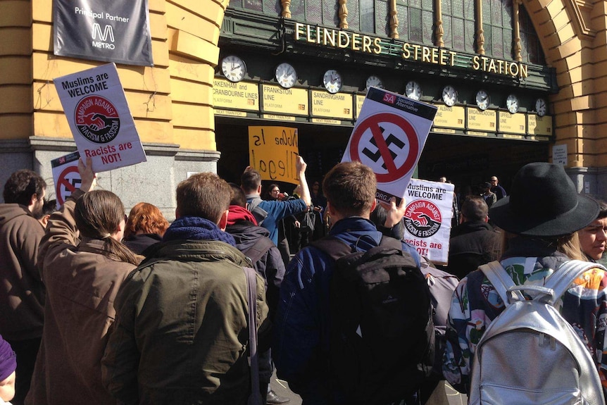 Crowds protest against Australian Border Force visa checks in the Melbourne CBD August 28, 2015