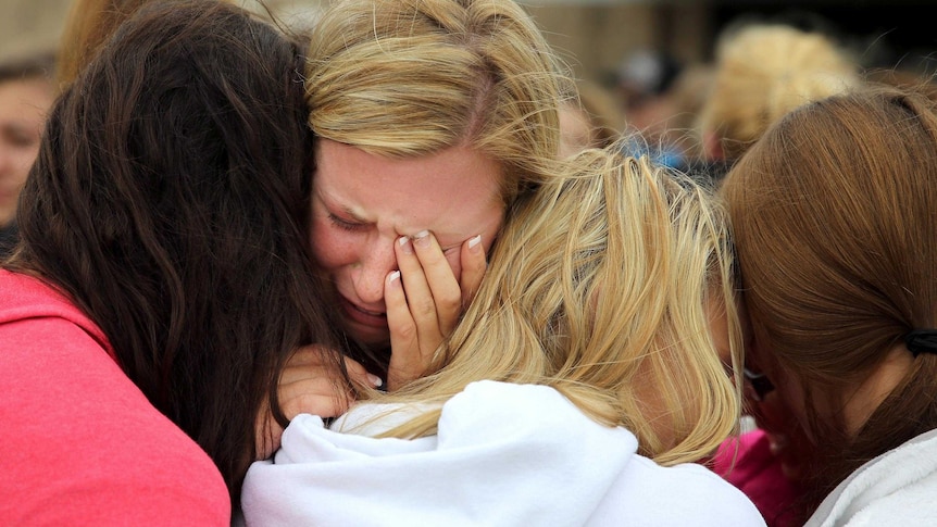 Mackenzie Wernet is embraced by friends after the explosion in West, Texas.