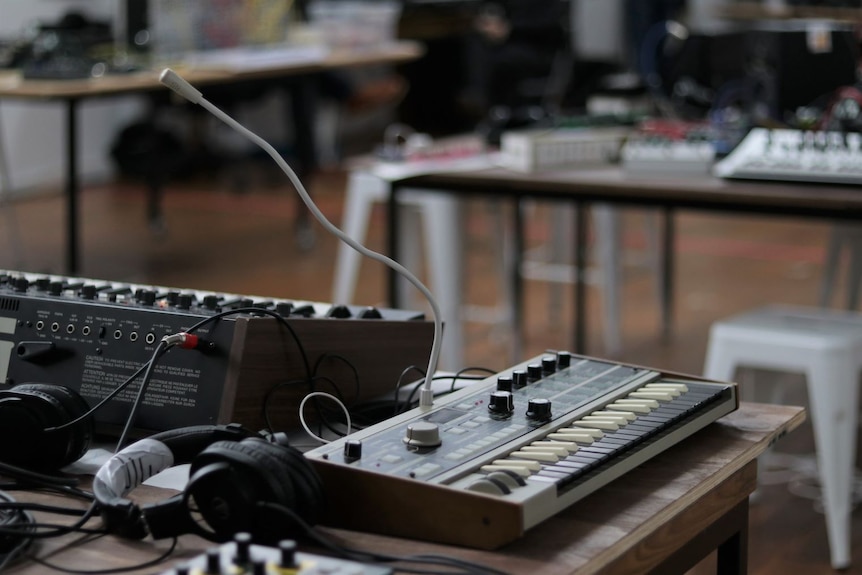 Music recording equipment and a synthesizer.