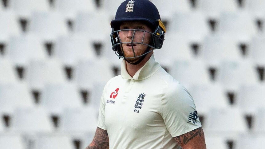 Ben Stokes carries his bat and looks out to the crowd as he walks off the field.