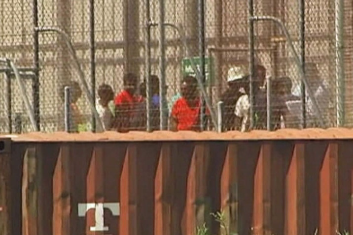 TV still of Christmas Island detainees.