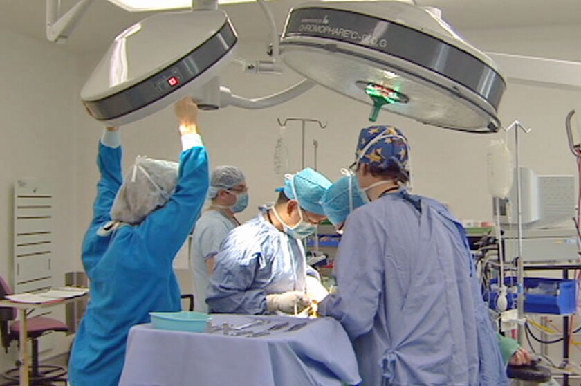 Video still: surgeons performing an operation in Canberra - generic