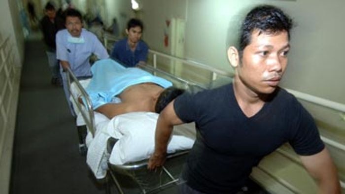 A 2005 bomb blast victim is taken by volunteers for treatment at a hospital in Bali.