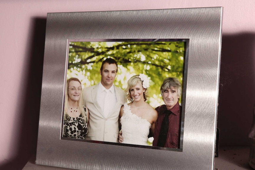 A photo of Robyn and her husband Terry, with her daughter and her husband on their wedding day.