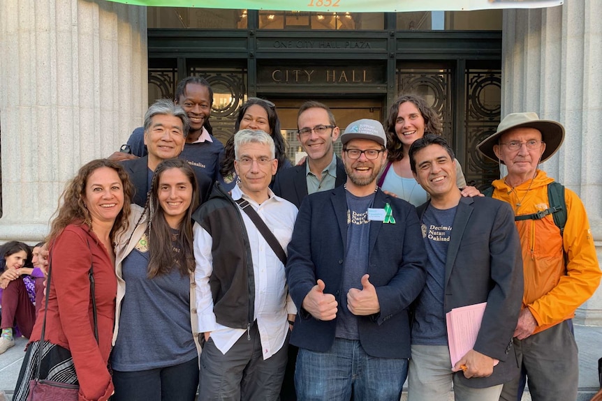 Members of Decriminalise Nature Oakland outside City Hall