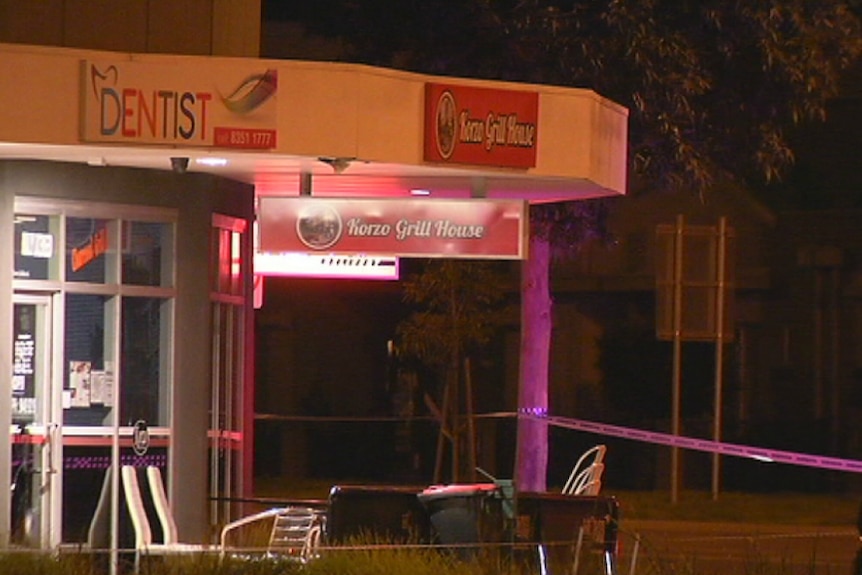 Police tap around the Korzo Grill House in Caroline Springs