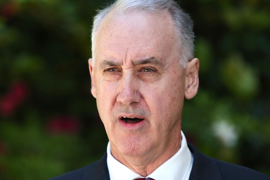 A close-up head shot of WA Liberal leader David Honey speaking with a serious look on his face.