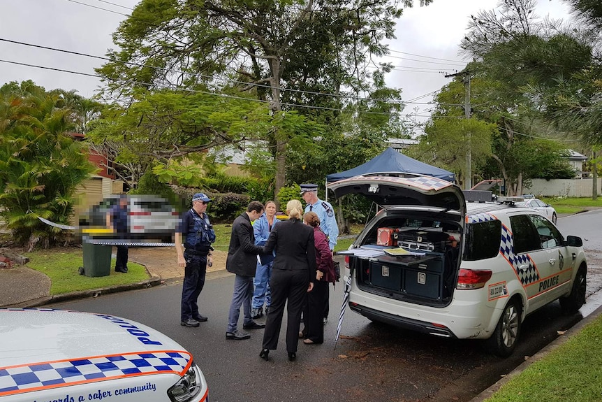 Police outside a house in the Gap where a four-month old boy suffered critical injuries.