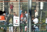 Detainees behind the fence