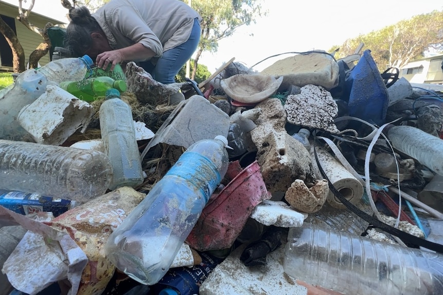 A pile of debris on a beach.