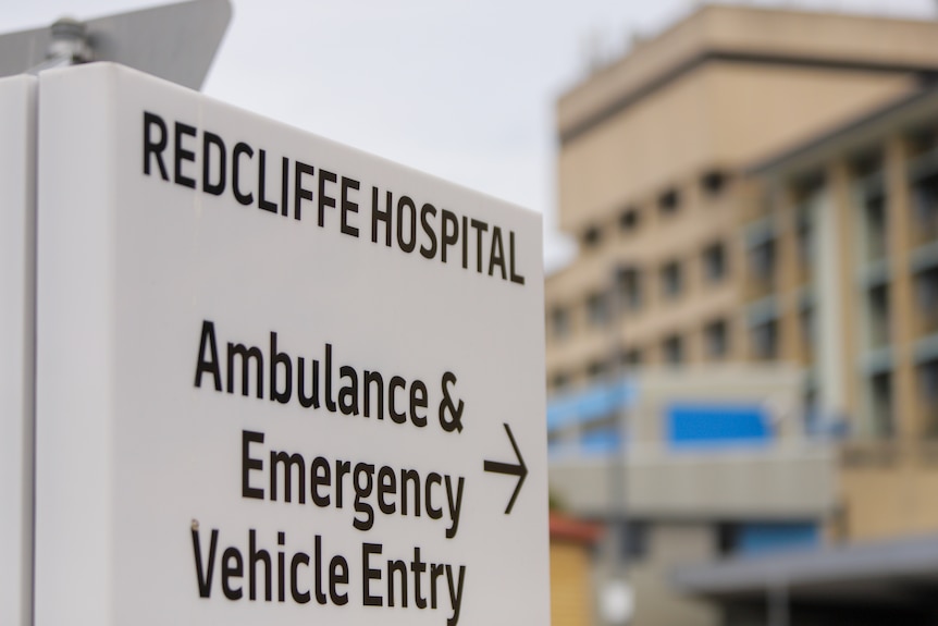 A sign says Redcliffe Hospital, with an arrow pointing to ambulance and emergency vehicle entry.