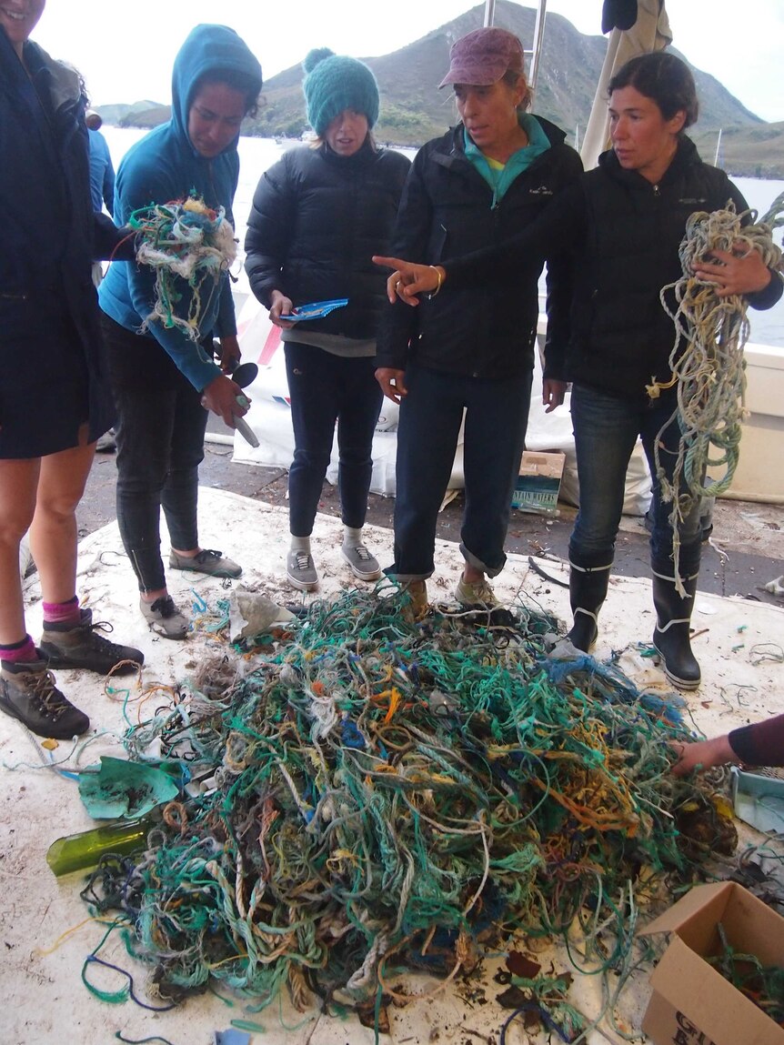 Volunteers with rubbish collected from a beach