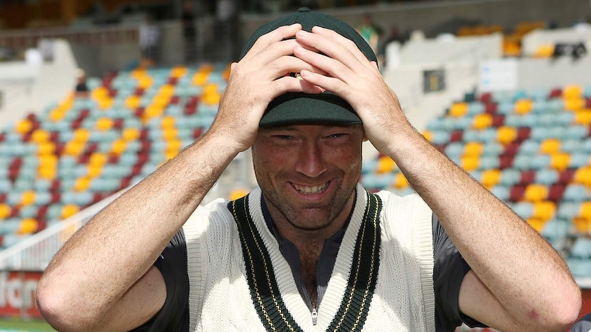 Rob Quiney tries on his baggy green cap