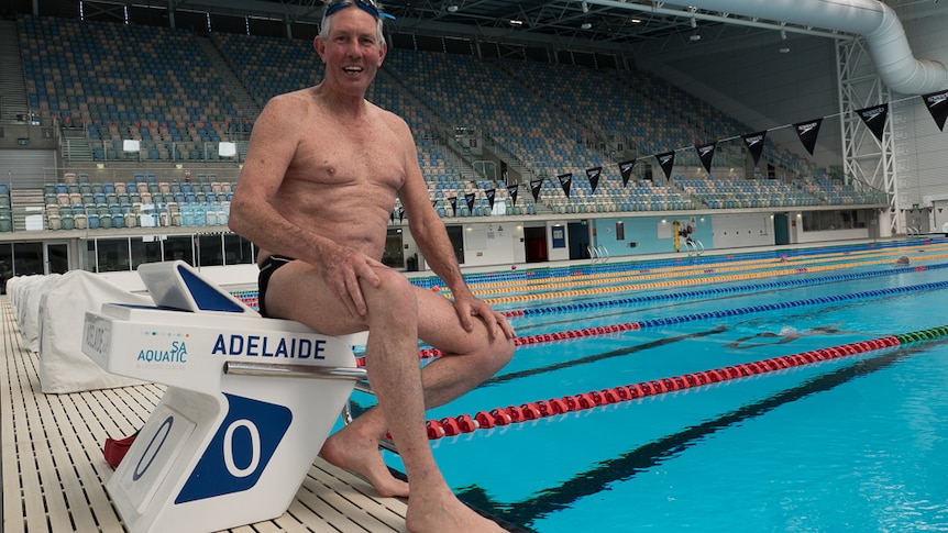 Rodney Biggs sitting on the starting blocks at the SA Aquatic and Leisure Centre.