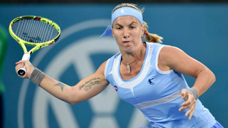 Russian tennis player Svetlana Kuznetsova holding a tennis racquet.