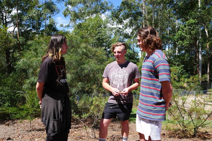 Three teenagers talking