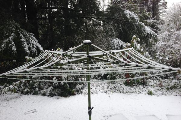 A hills hoist clothesline under snow