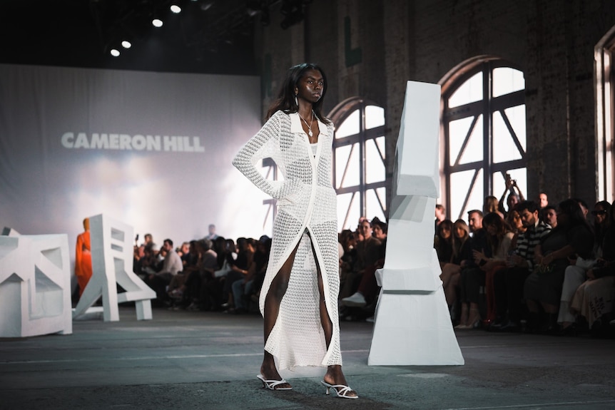 a young woman modelling clothes on a runway