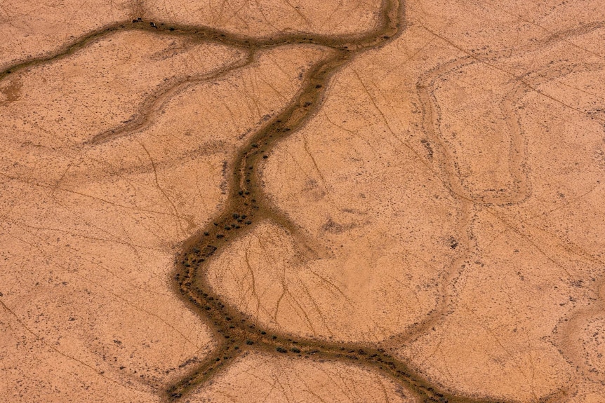 The red coloured earth and unique water system of Lake Eyre is seen in northern South Australia.