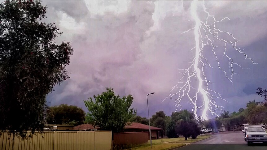 Huge bolt of lightning in stormy sky