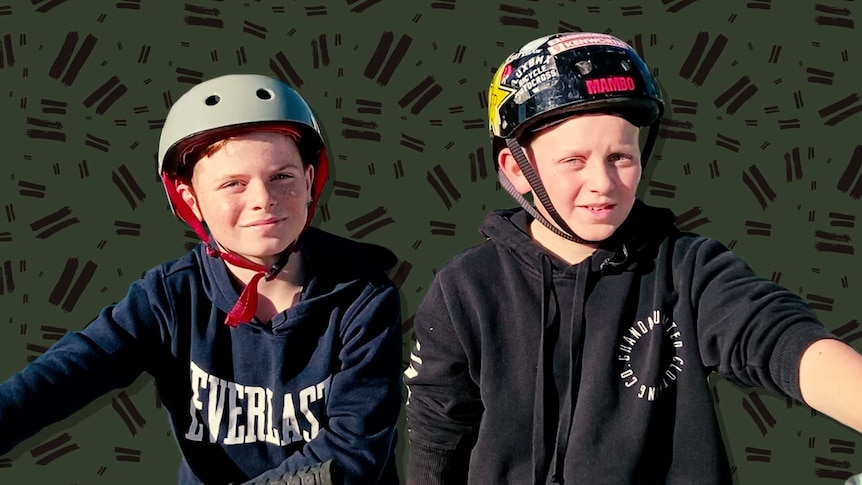 Boys on their bikes wearing helmets.