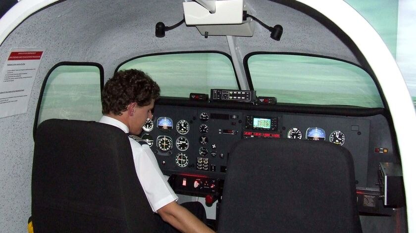 A pilot sits in the multi-million-dollar flight simulator at the Australian Airline Pilot Academy