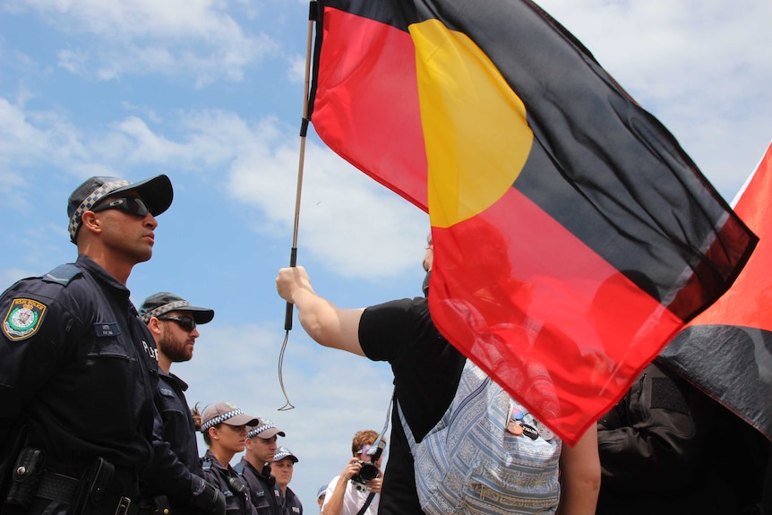 Protester with Aboriginal flag