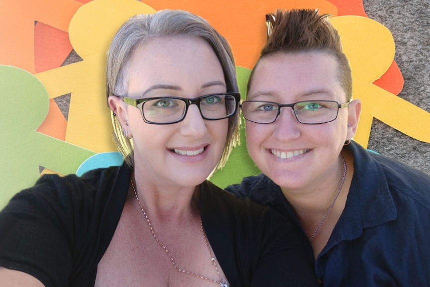 Rebecca Schulkins and wife Amy Schulkins smile.