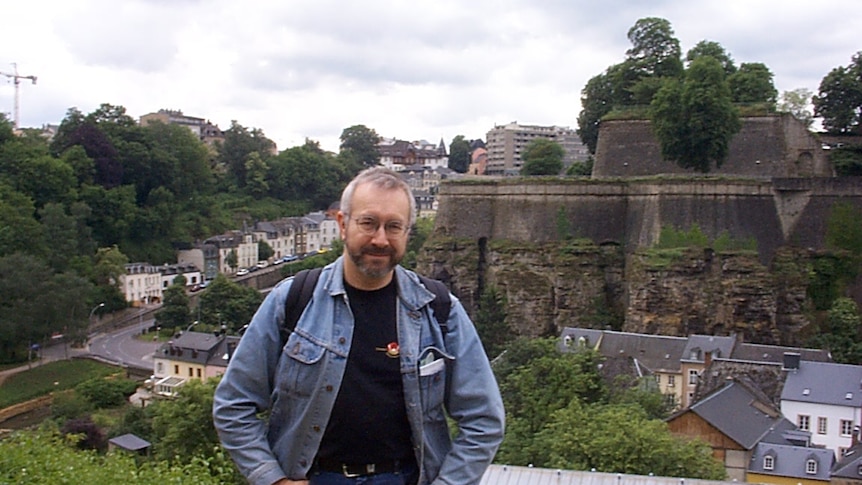 Robin Wiley stands in front of the remains of a centuries old fortified city in Luxembourg.