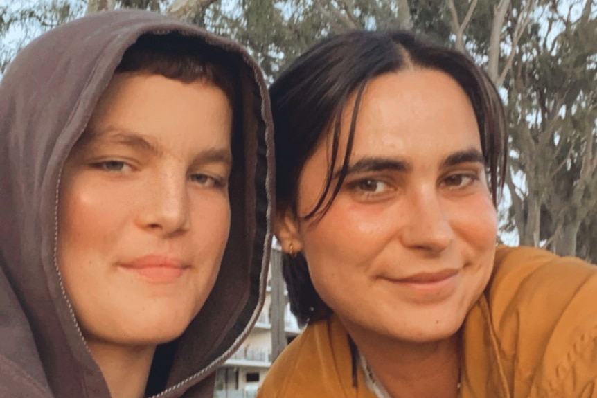Woman with dark hair, with teenage son