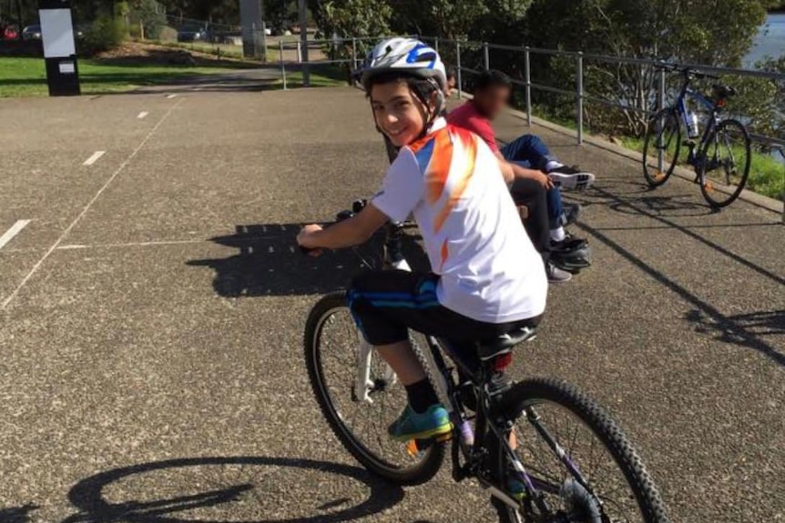 A boy riding a bike