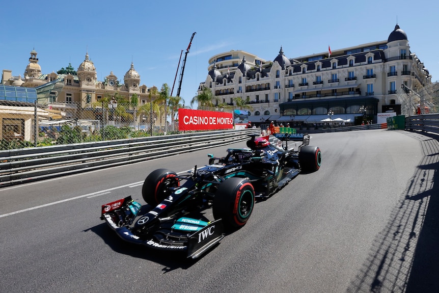 F1 car drives around the streets of Monaco.